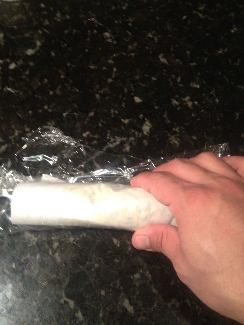 Begin shaping into a roll using your hands.