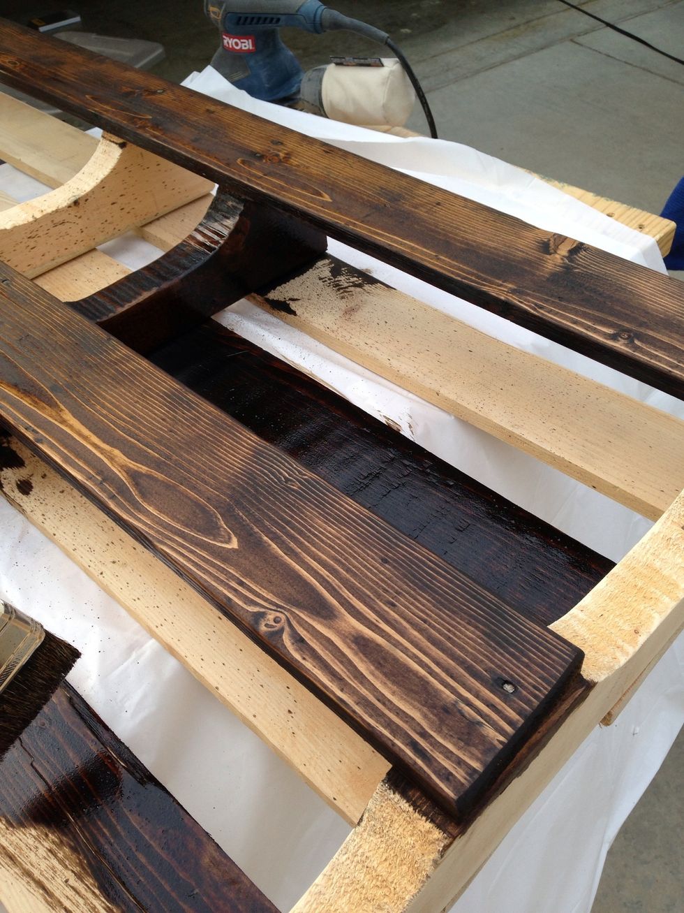 Begin staining. We brushed on insides to outsides, left to right. This way it was easier to wipe off the stain in the same direction.