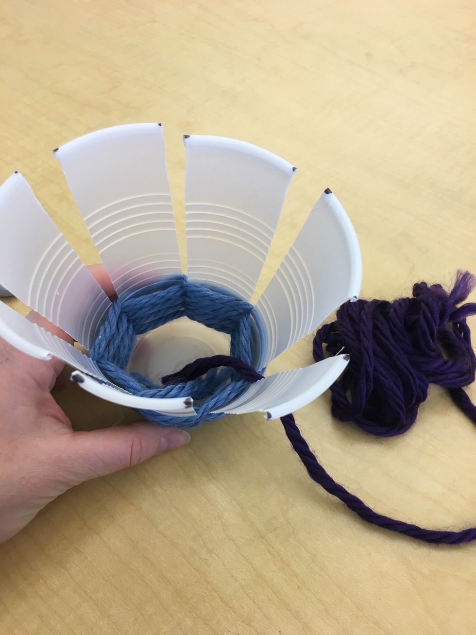 Begin the next color as you did the first. Tuck the end if the yarn inside of your cup.
