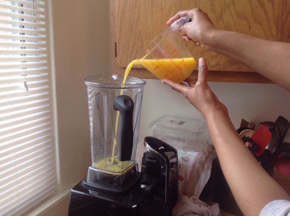 Begin the process with pouring the orange juice first *side note the reason why you want to pour the liquid first is so that it doesn't cause damage to the blades*