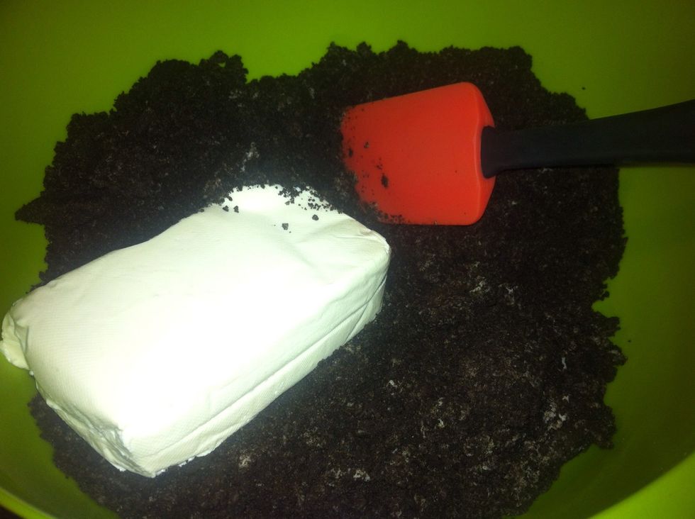 Begin to combine the Oreos with the room temperature cream cheese. Most effective using your hands.