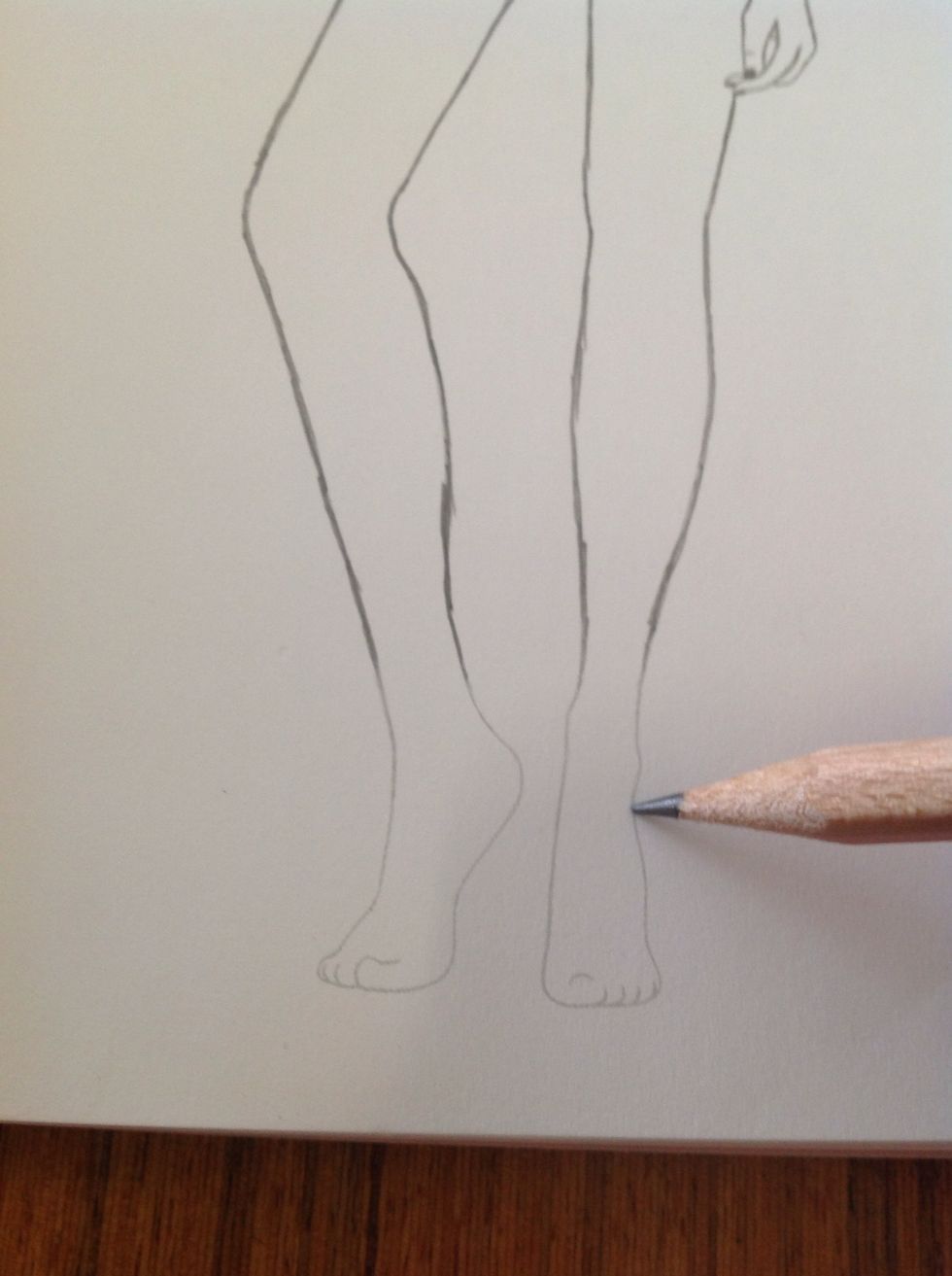 Begin to draw the shoes.