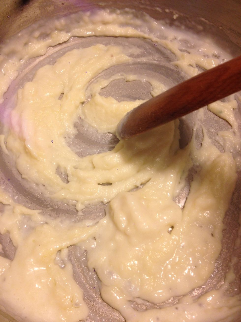 Begin to slowly add milk, stirring out any lumps as you go. I just used a wooden spoon but you may find a whisk easier.