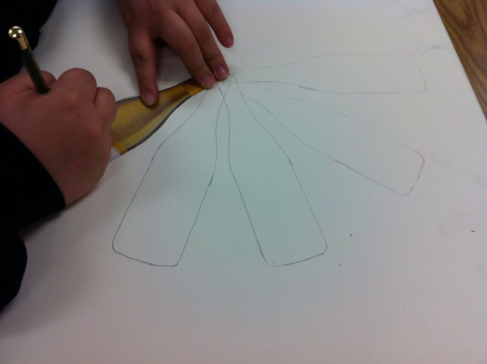 Begin tracing your shape with 4H pencil to create a pattern of your choice.