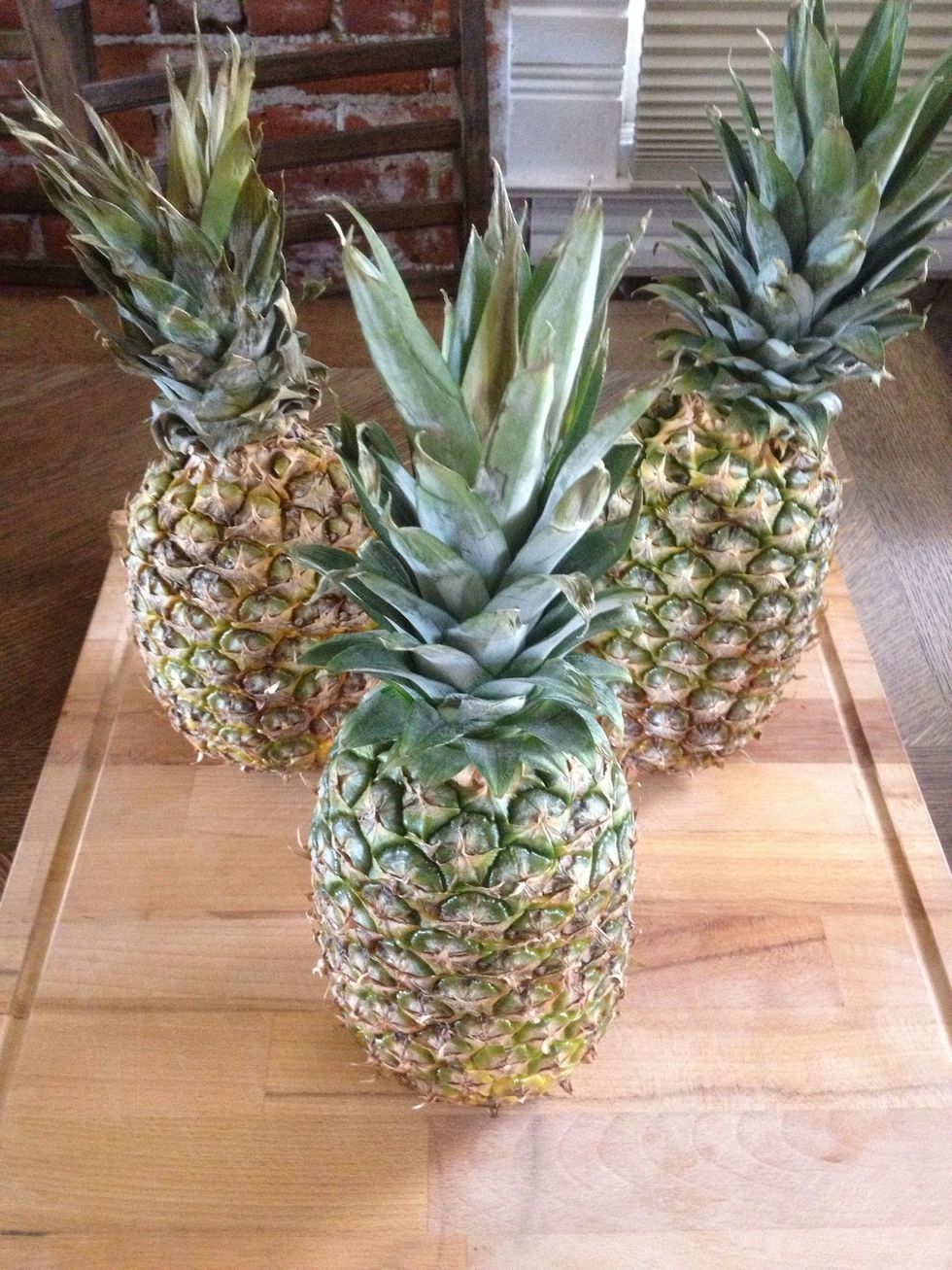 Begin with a large cutting board. Pineapples should be ripe, I rely on golden color & a fragrant smell.