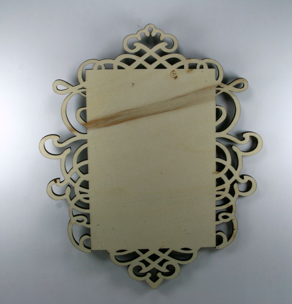 Begin with a purchased wooden plaque. Wipe it down to remove dust.