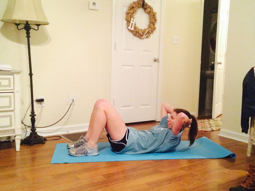 Begin with basic crunches. Make sure your shoulder blades come off the ground completely. Do 4 sets of 25 reps