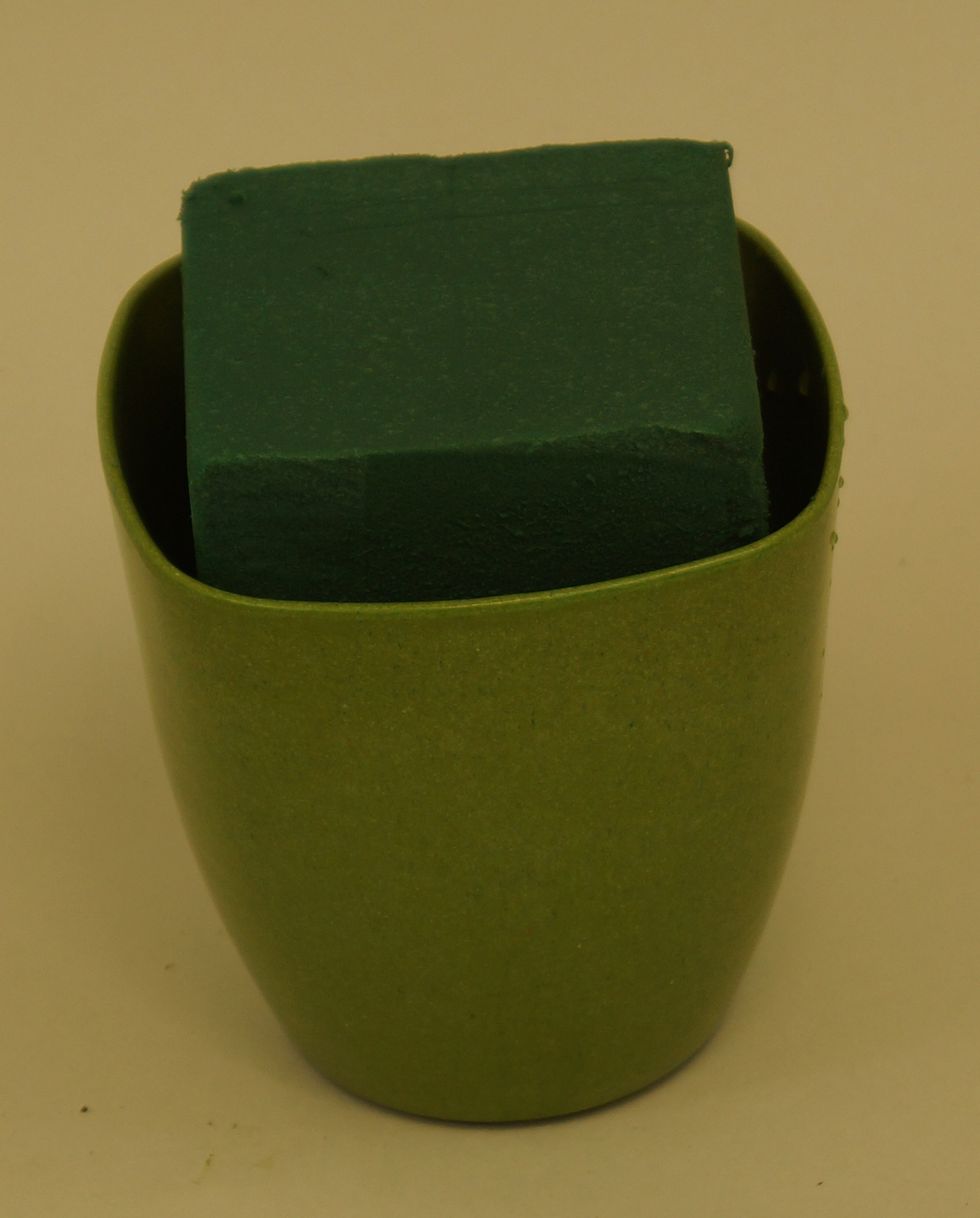 Begin with float soaking foam in water to saturate. Insert 1/3 OASIS\u00ae Floral Foam Maxlife brick into a 4-1/2\u201d ECOssential\u00ae Container