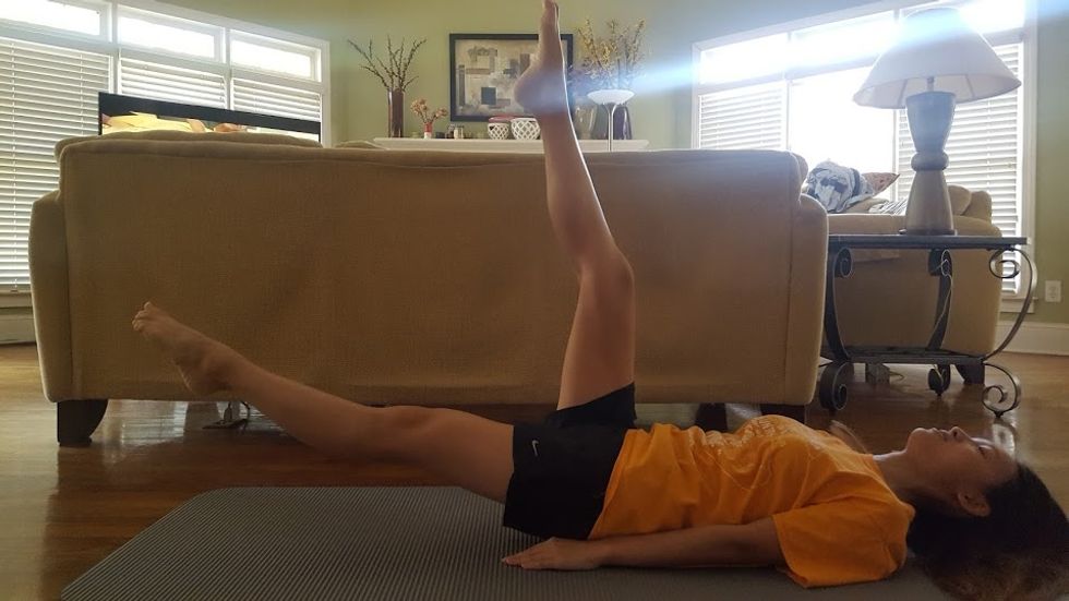 Begin with flutter kicks (continued). Lift one leg at a time to the highest point that you can without bending your leg.