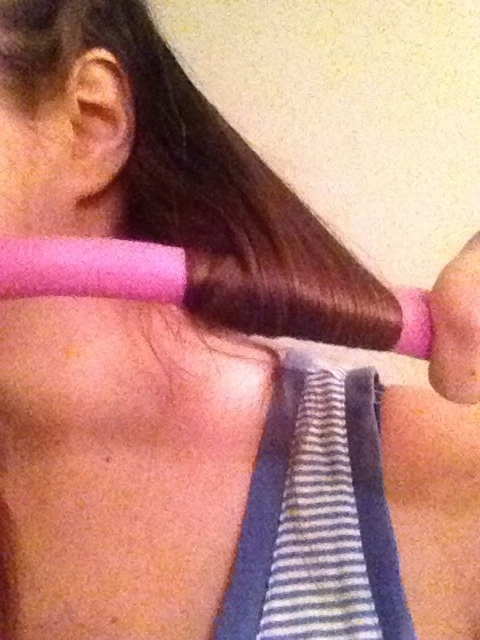 Begin wrapping your section around the rod, twisting up towards the scalp.