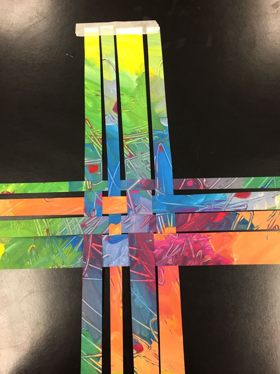 Begin your weaving by taping down 4 strips. Start weaving over, under, over, under. Add strips vertically and horizontally until you have run out of strips.