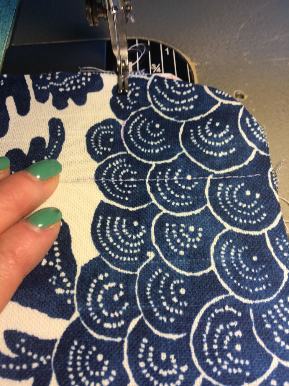 Beginning at the edge of the fabrics, you will need to stitch basket front and back together down the two long stitch lines first then across one of the short stitch lines as shown.