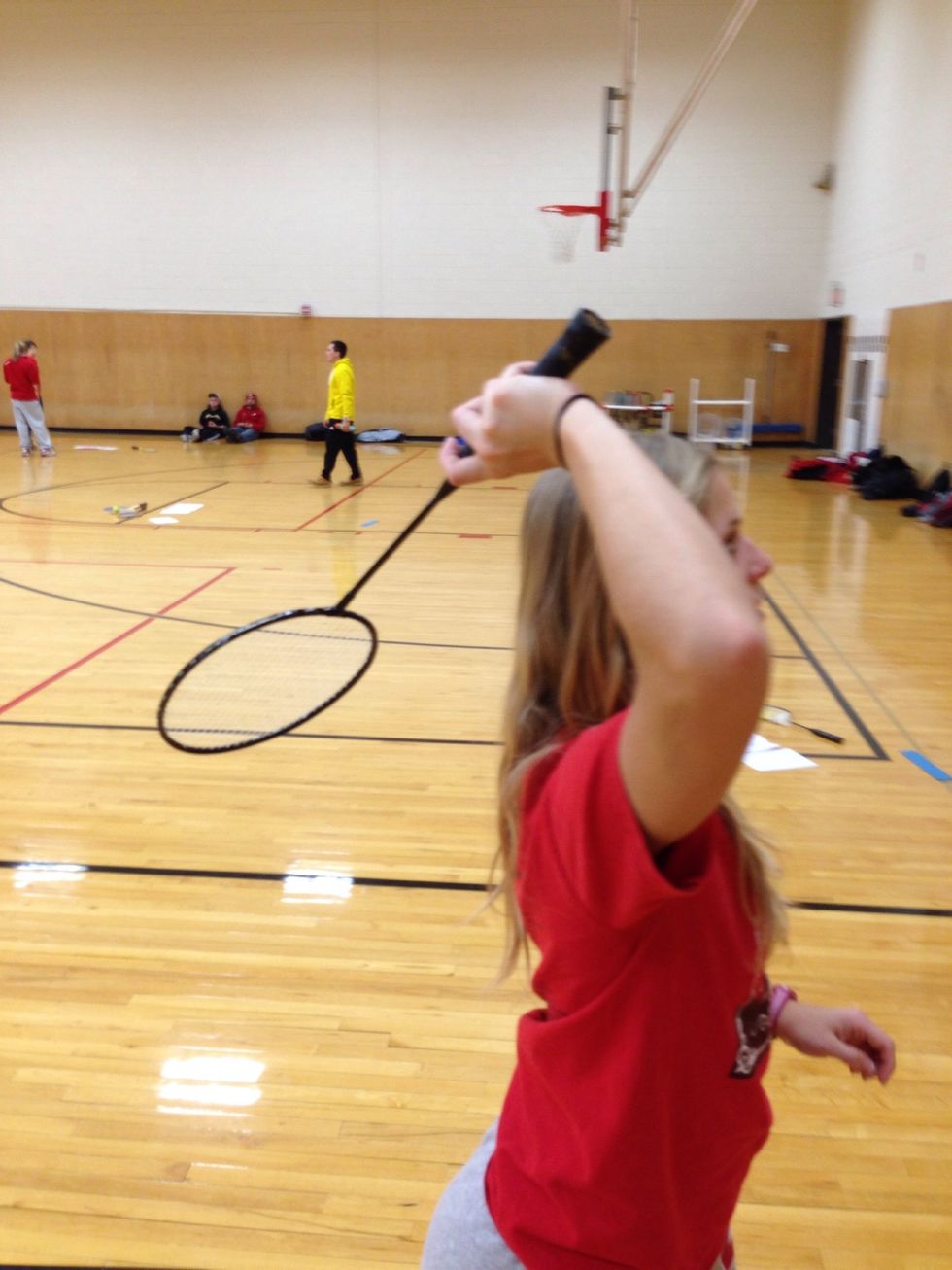 Being your racquet to scratch back position.