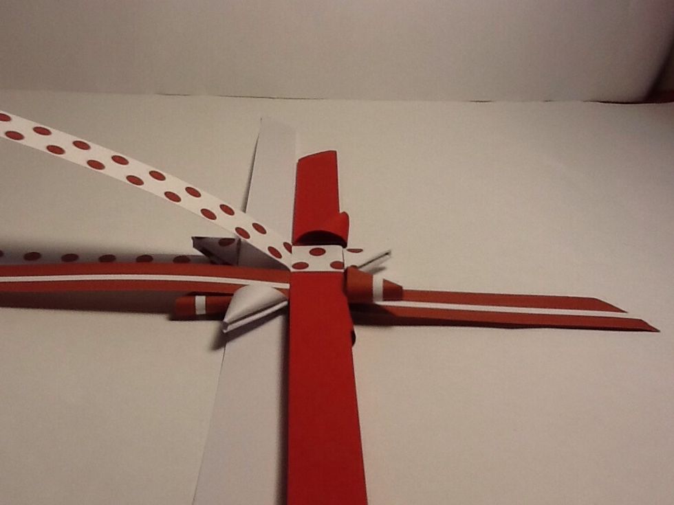 Bend a strip back (doesn't matter witch one ) make sure you don't smash the flat triangle under neath I bent the spotted back