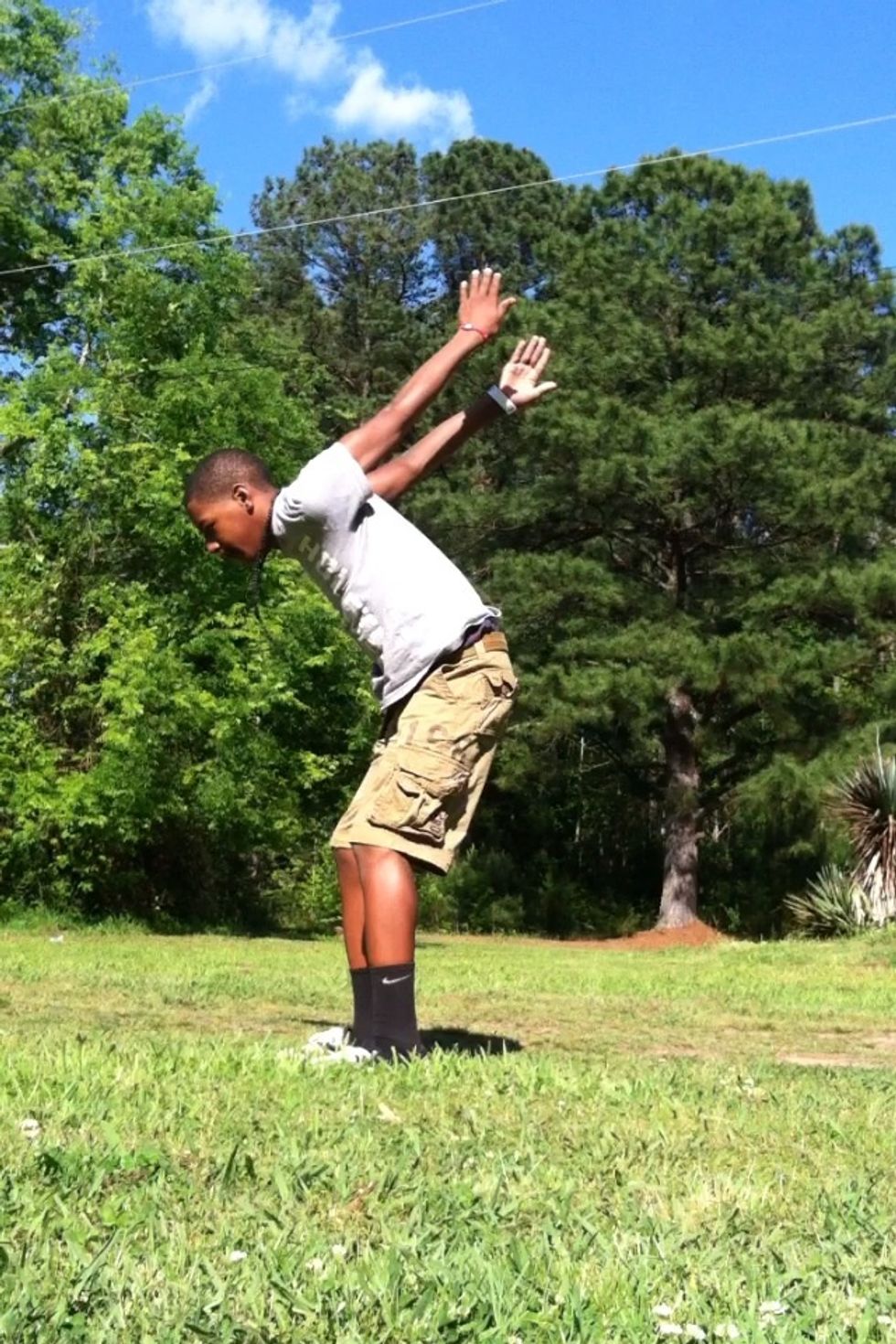 Bend at the knees and swing arms.