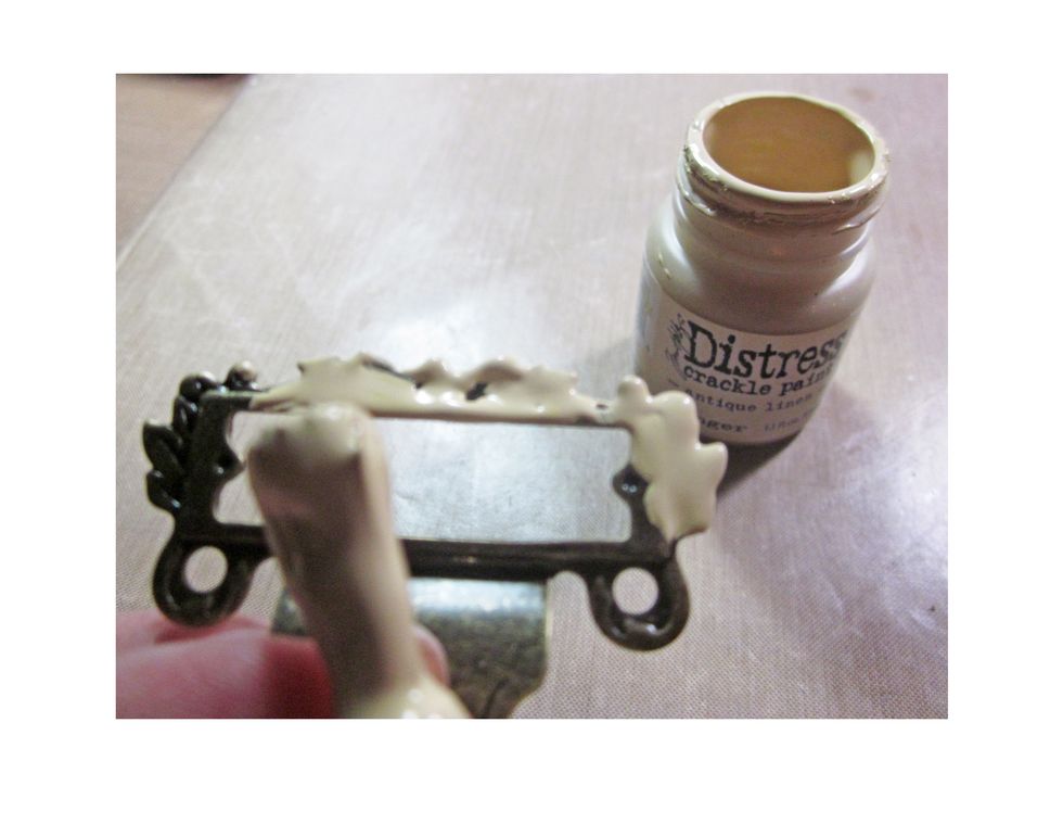 Bend down the base hook of a Graphic 45 label holder and then paint with Distress Crackle Paint.
