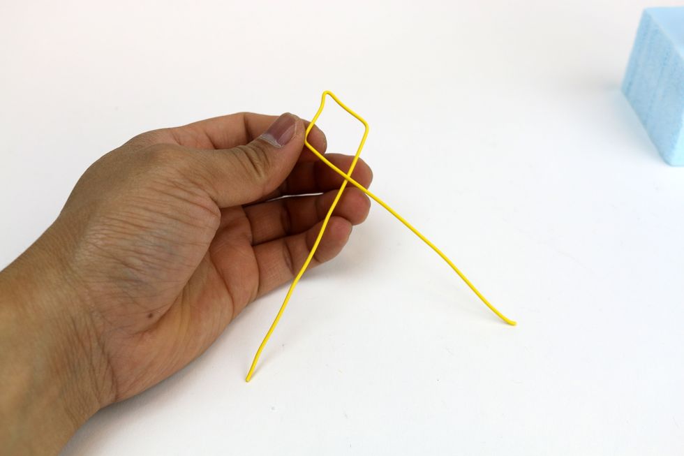 Bend it in half to make a traditional diamond kite shape.