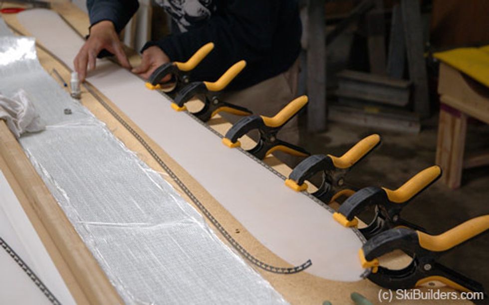 Bend the edges and line it up with the cut out base material