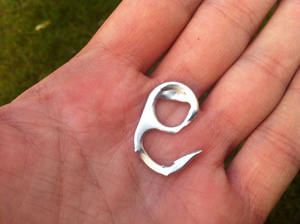 Bend the hook out a little. Then using a file or rough rock. File down excess metal around the ring and sharpen the point.