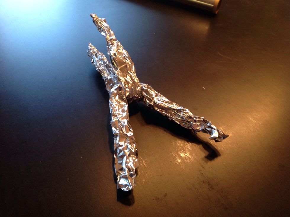 Bend the sticks into the shape of a V, then put them together.