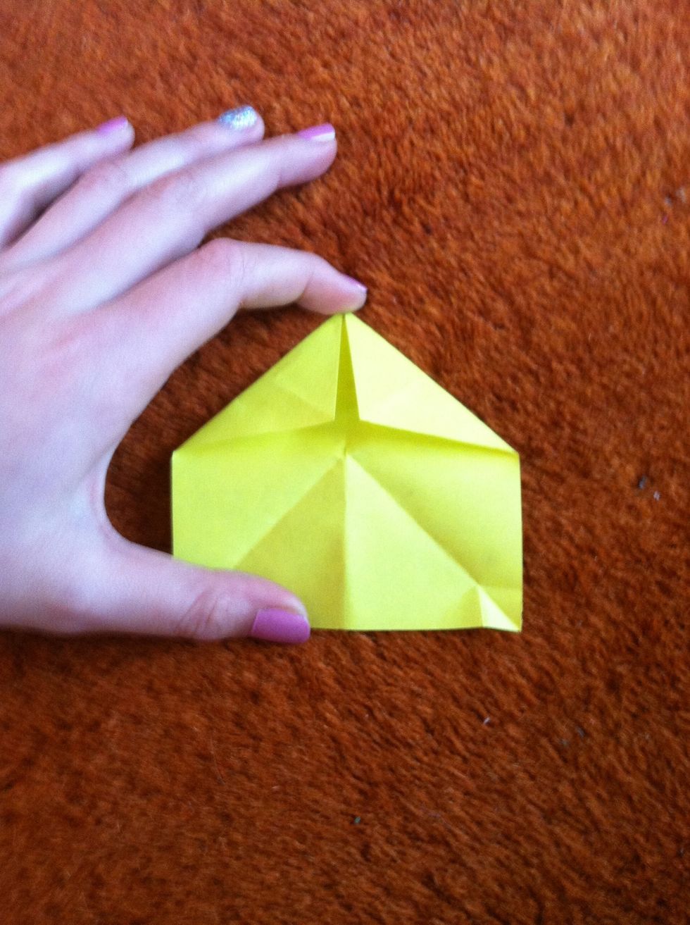 Bend the two edges to the middle of the square