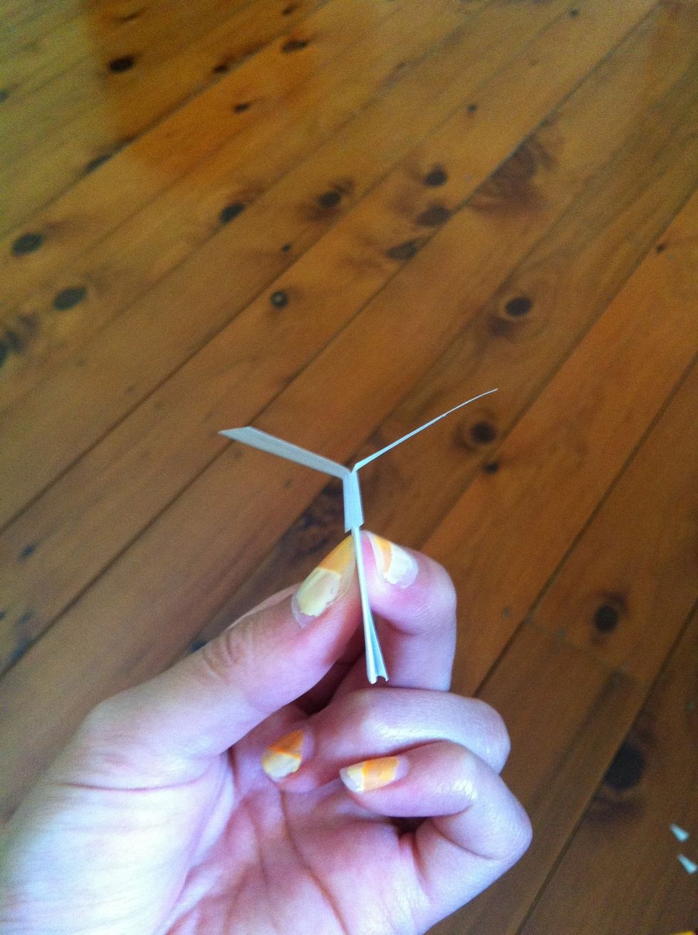 Bend the wings up so that it looks like a 'Y' shape