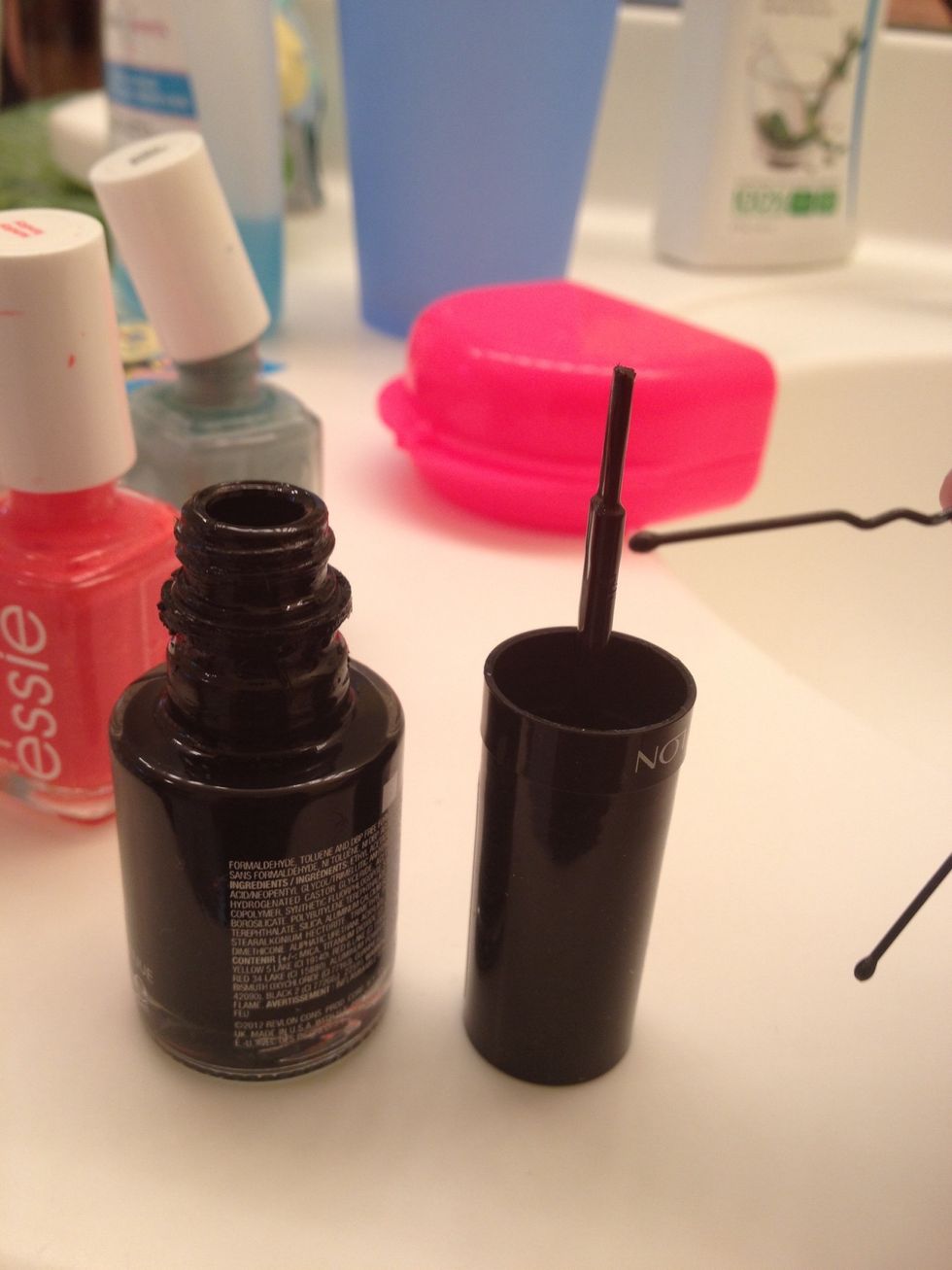 Bend your bobby pin, and dip the end into your black polish.