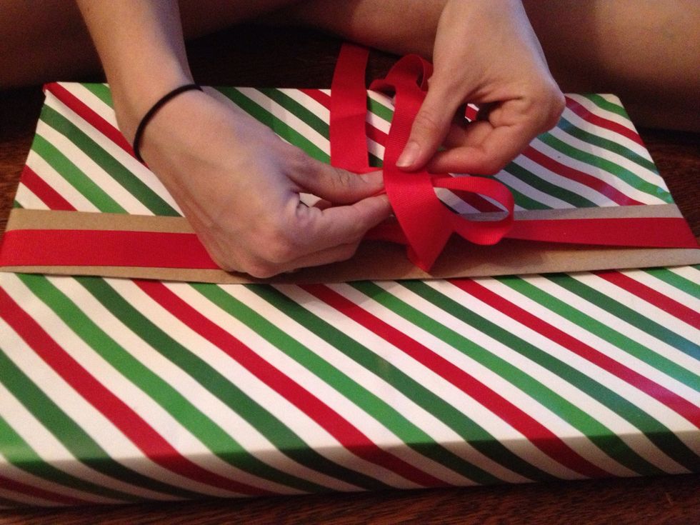 Bend your loop over. Take the other end of the ribbon and wrap it OVER your loop. Pull it through like a normal tie