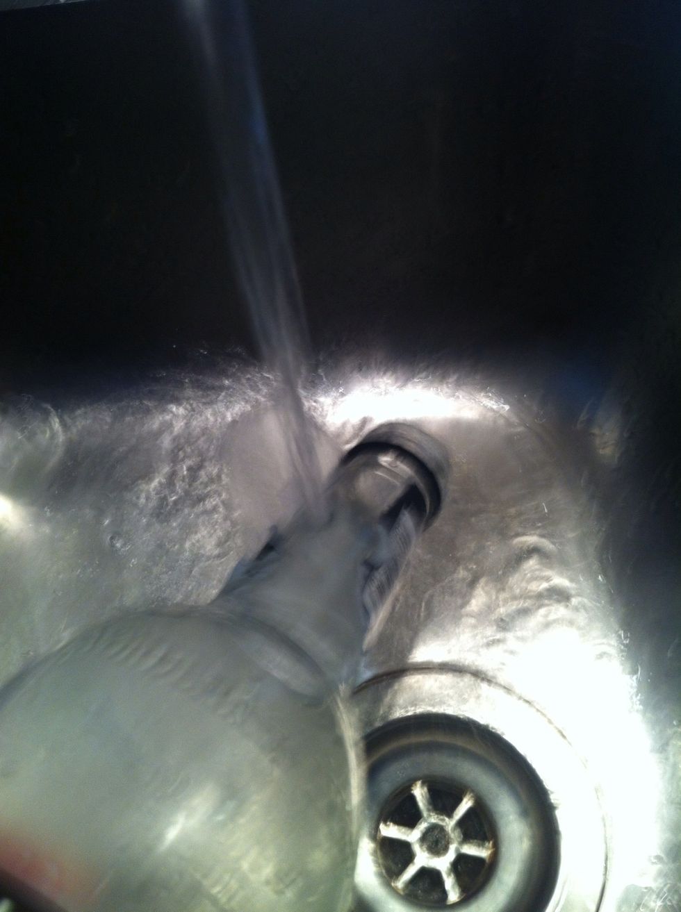 Best way to take off the label is to run hot water on it and peel off. be sure to get rid of the glue