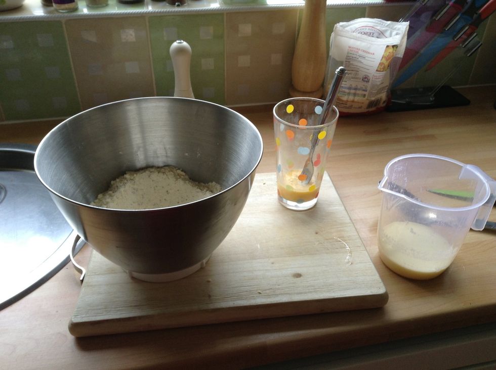 Bet an egg and measure out your milk, then create a well in the centre of your mix
