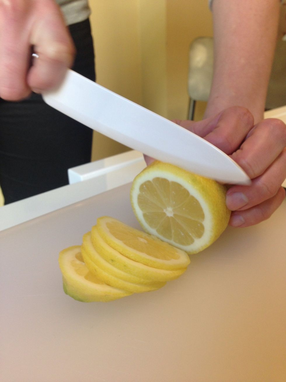 Big ice cubes are great for punch, because they take much longer to melt, so your drink won't get watered down. Twenty-four hours before serving, start making them by cutting a lemon into thin slices.