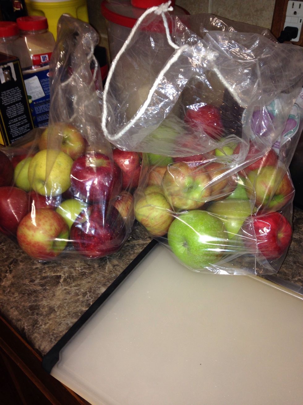 Big ol' bags of apples, fresh from the orchard. I'm using 15 lbs for around 3qt of sauce. Output depends on size of apples, how juicy, etcetera.