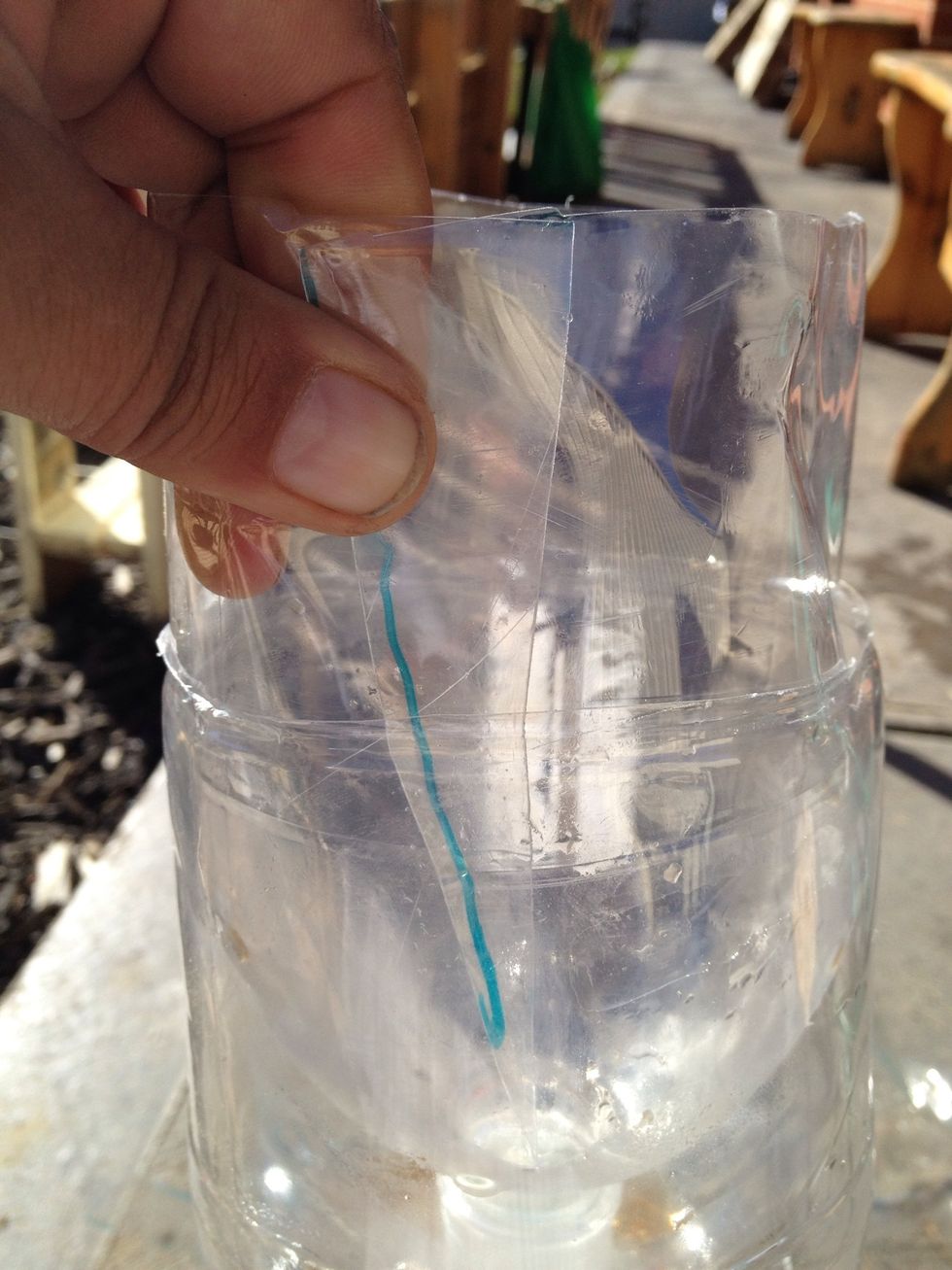 Bigger bottles can be just cut in half and squash the top half inside the bottom half upside down. Cut a straight line thru any creases and tape secure to get a snug fit