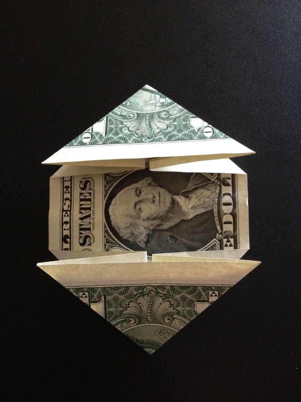 Bill with both ends folded into triangles