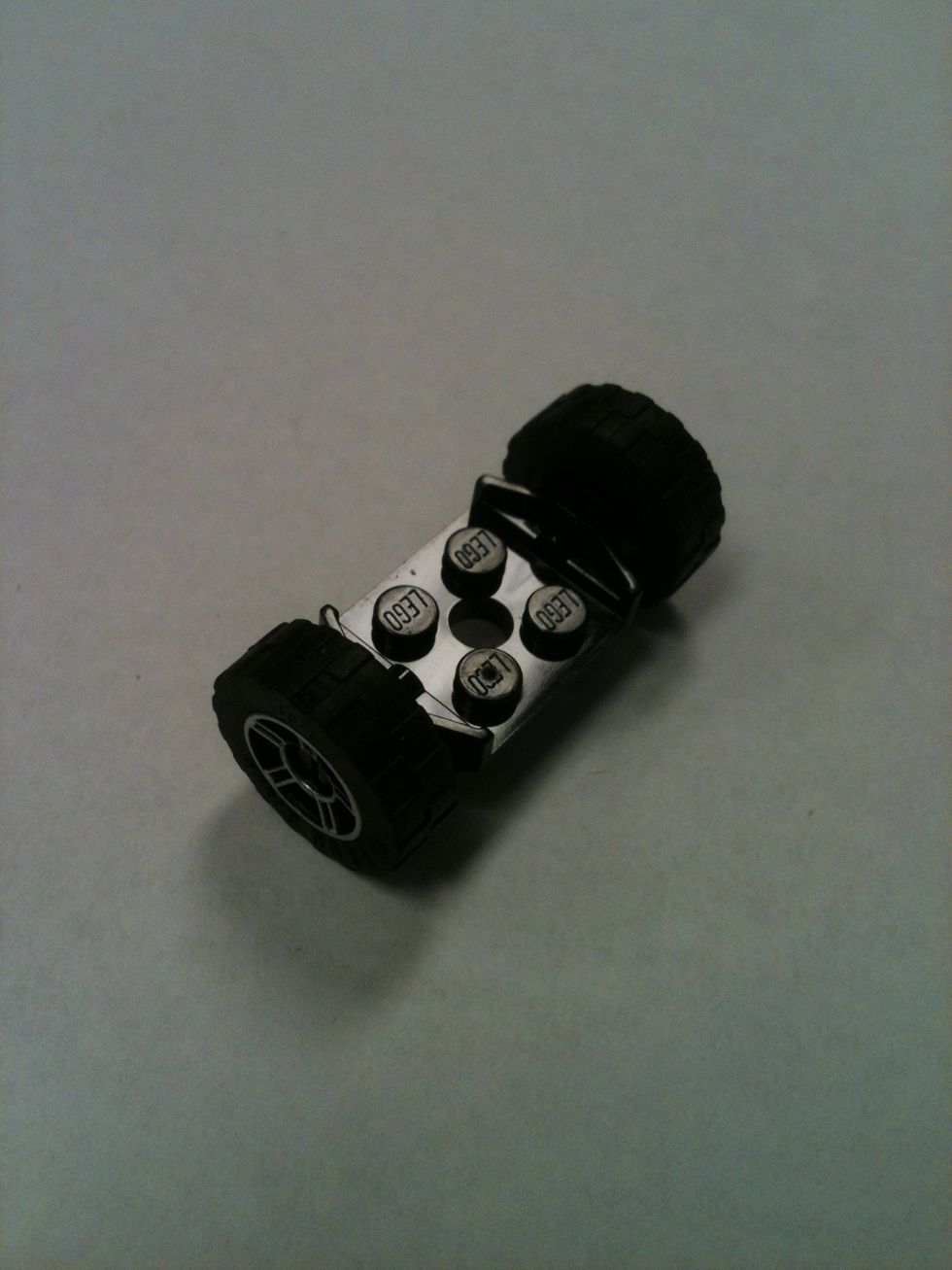 Black 2x2 wheel axle (with tires)