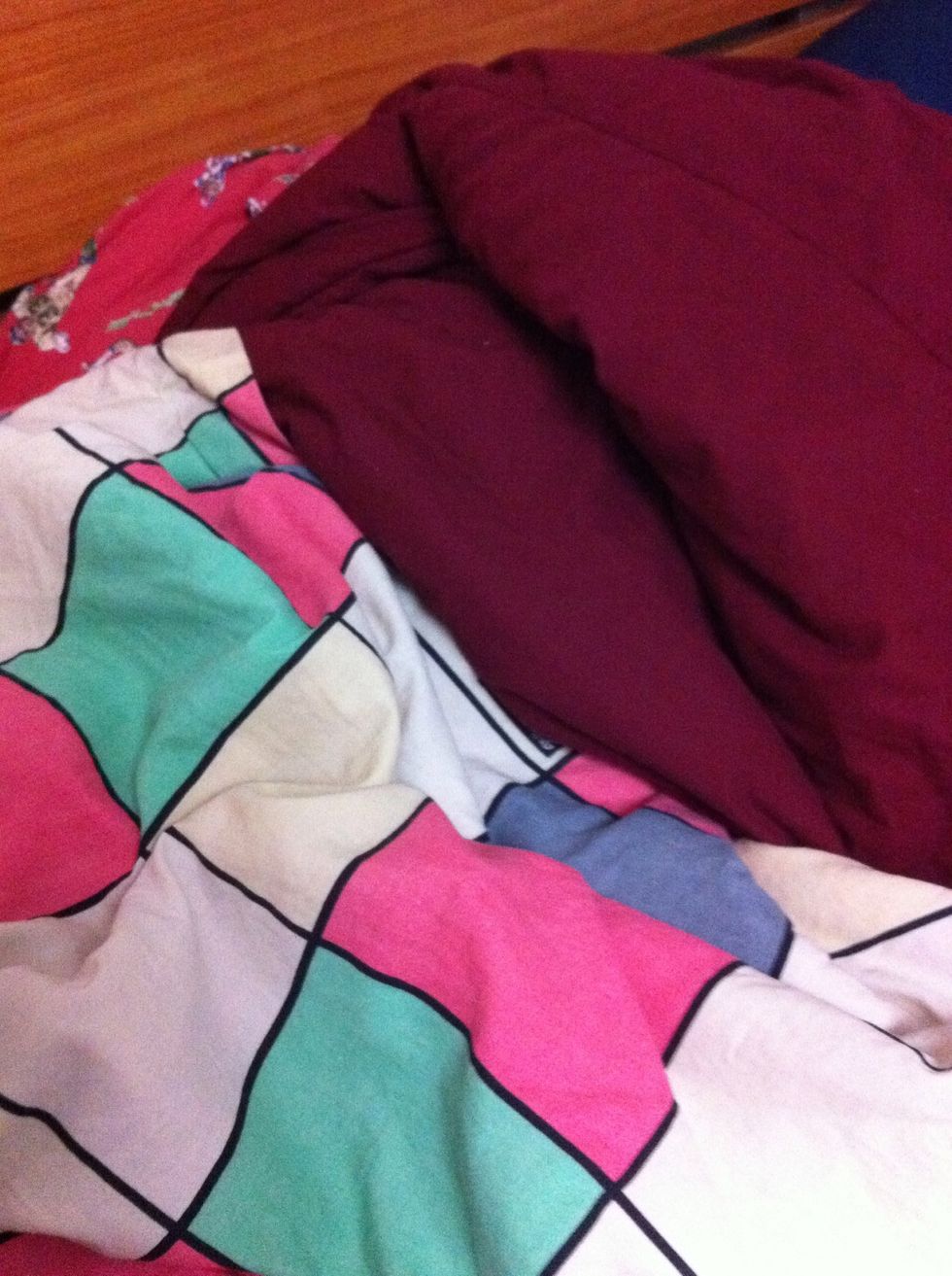 Blankets and/or sleeping bag. I don't know about you, but I'd rather not sleep on concrete, stone, brick, dirt, or whatever dirty place you end up sleeping in.