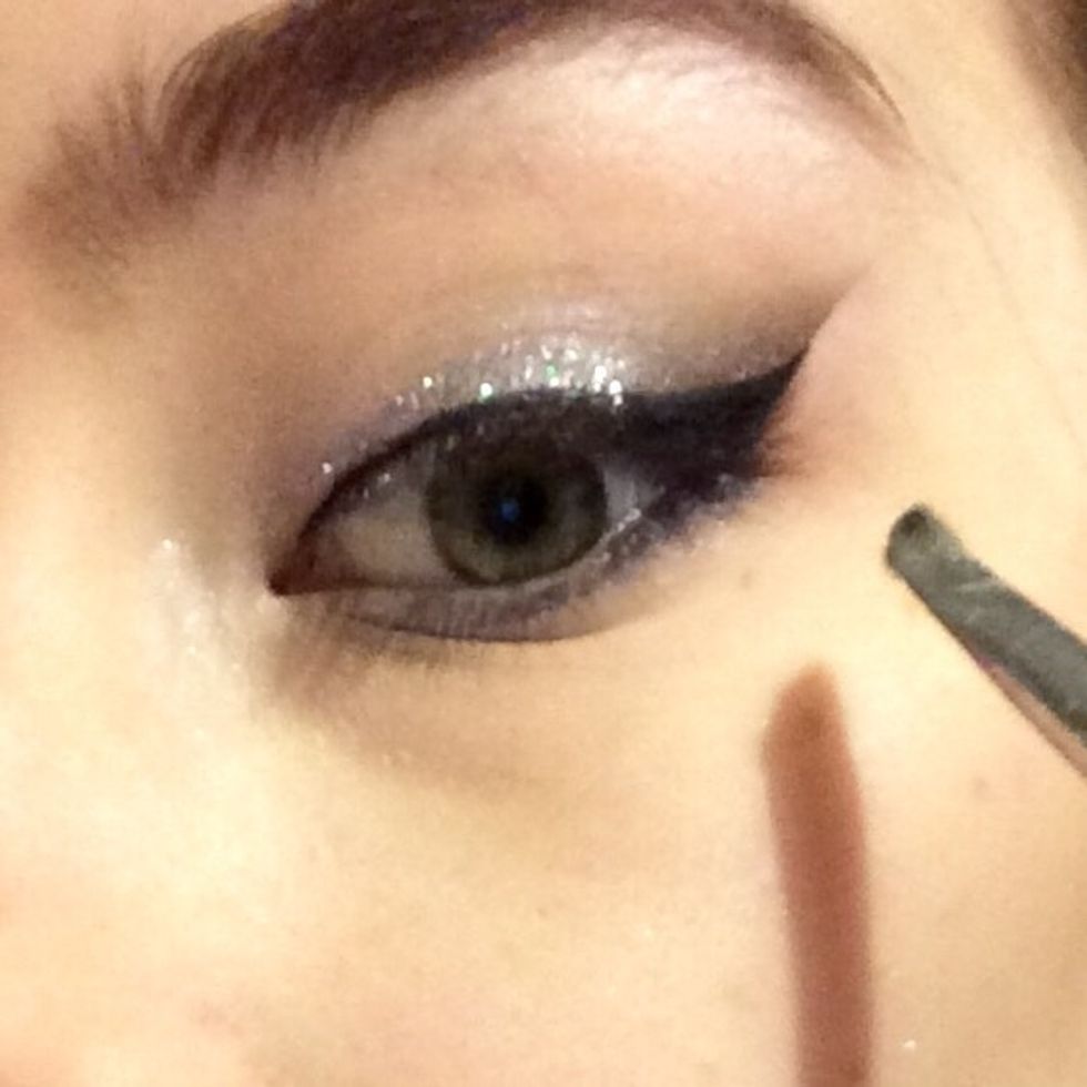 Blend a little black along the outer lower lashline...