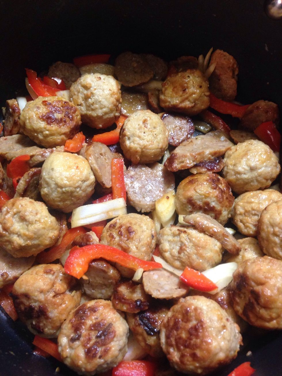 Blend all of your meats together and add onion and peppers if you choose