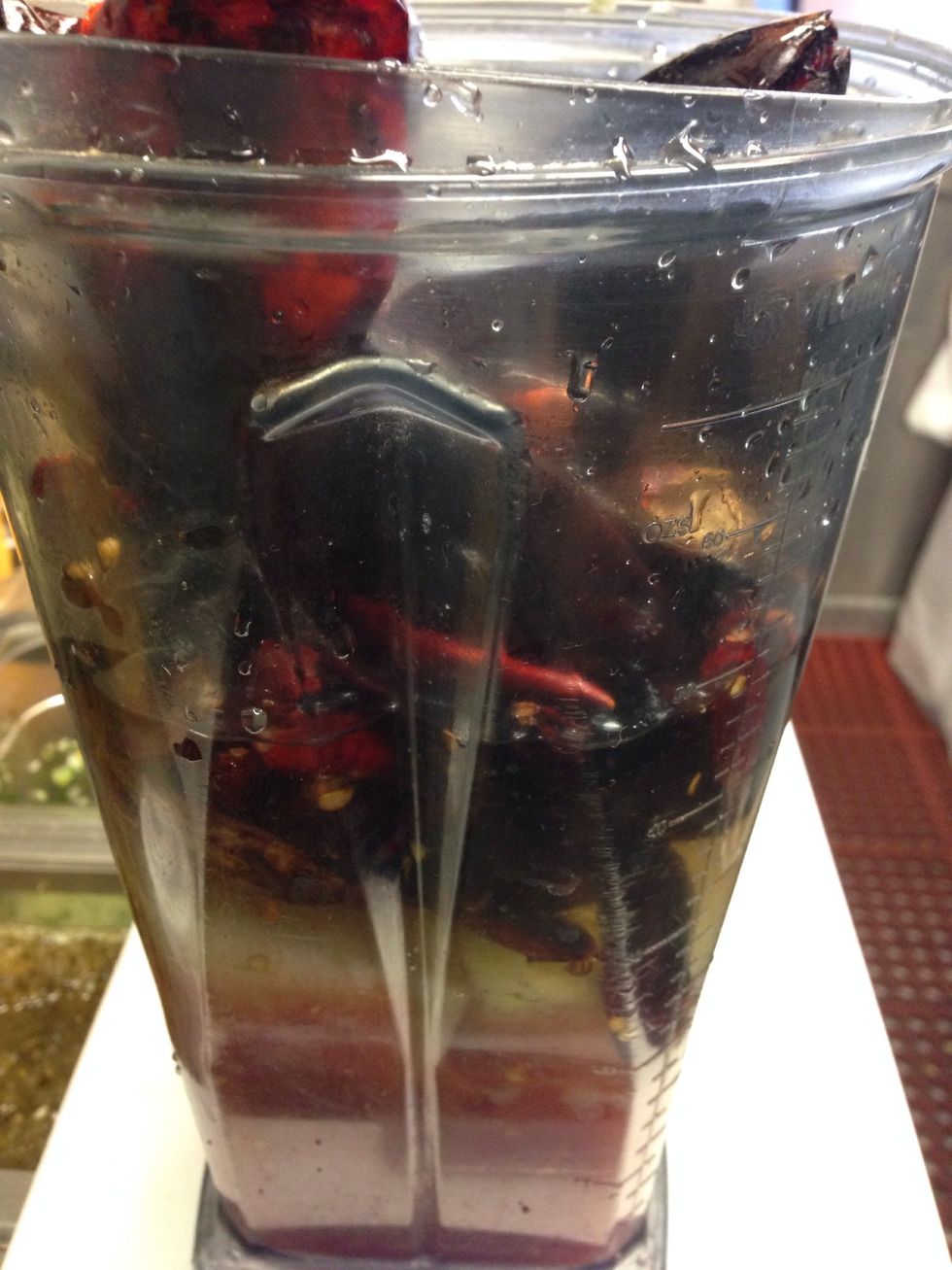 Blend Diced tomatoes, oil, water, chile, and onion. Add 1 tablespoon of salt in it.