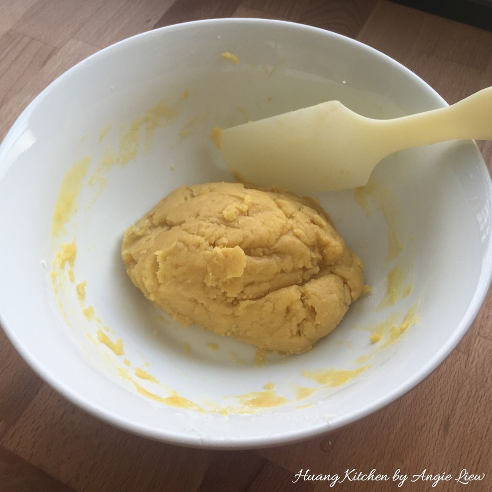 Blend in the melted margarine to form a soft dough.