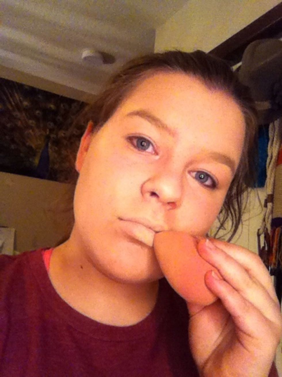 Blend out the concealer to cover completely both lips