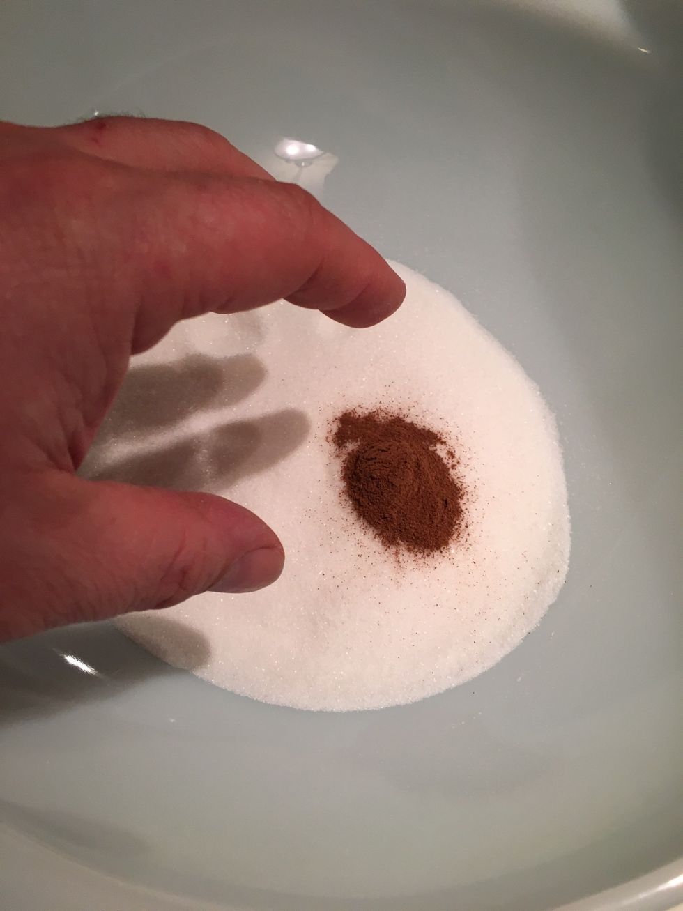 Blend sugar and cinnamon.