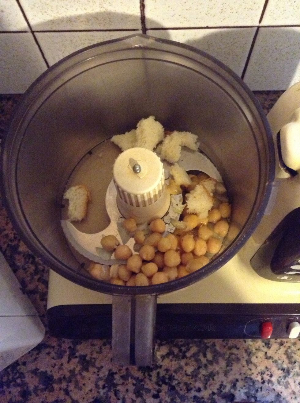 Blend together chickpeas, sandwich bread, minced onion, mustard, the egg and salt to taste.