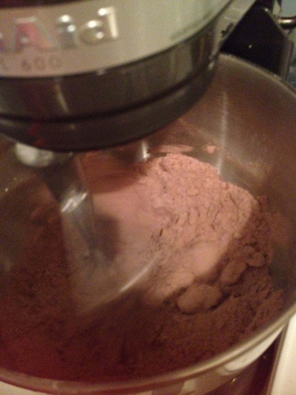 Blend together with flat beater until combined and add the chocolate. Beat until combine. Add vanilla extract and a pinch of salt.