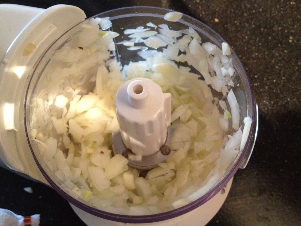 Blend up garlic with half an onion, just a bit to finely chop it