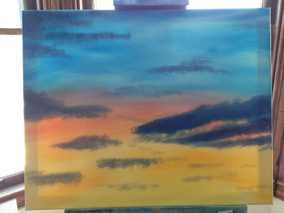 Blend with light horizontal strokes. Use your dirty blue brush and add some crimson. Layer in your dark clouds with horizontal dabs of varied intensity. When it looks like you want it, get a new brush