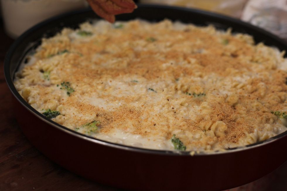 Bless those little delicate hands. She's back!! Get the boss to sprinkle a large handful of breadcrumbs all over the top, not too much it's just for a crunch and colour effect. ;)