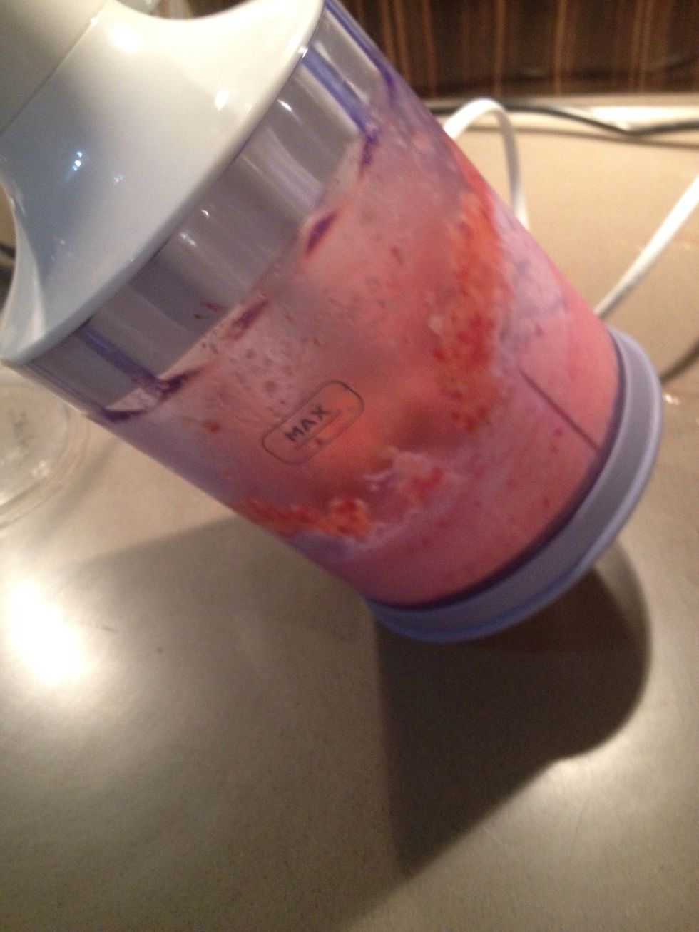 Blitz again. If possible (and secure), tilting the blender sometimes helps to get the fruit to bind properly and not stay stuck to the sides.