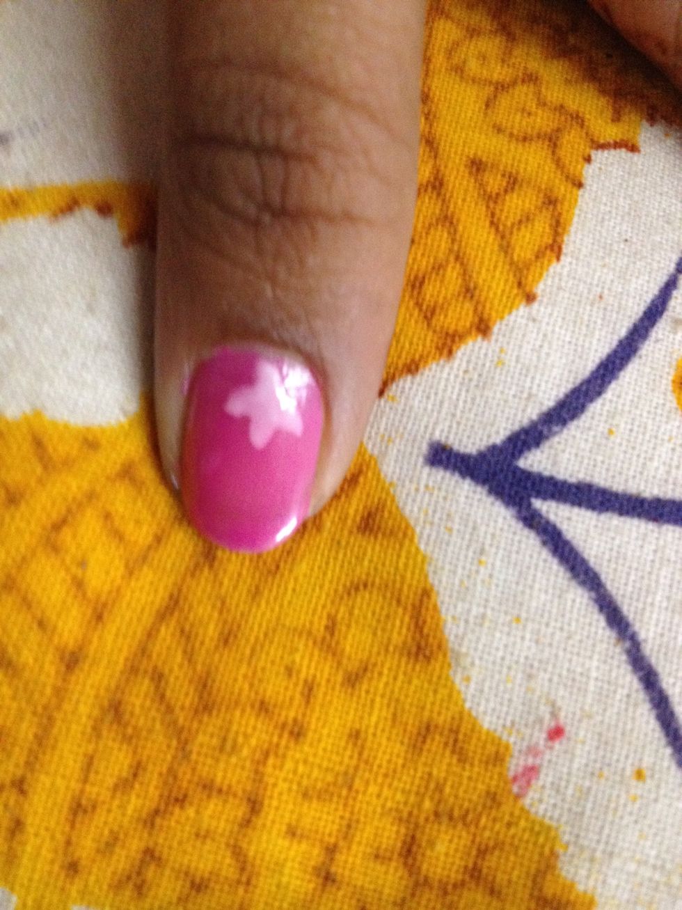 Blob of white shaped like an 'x' on a pink base