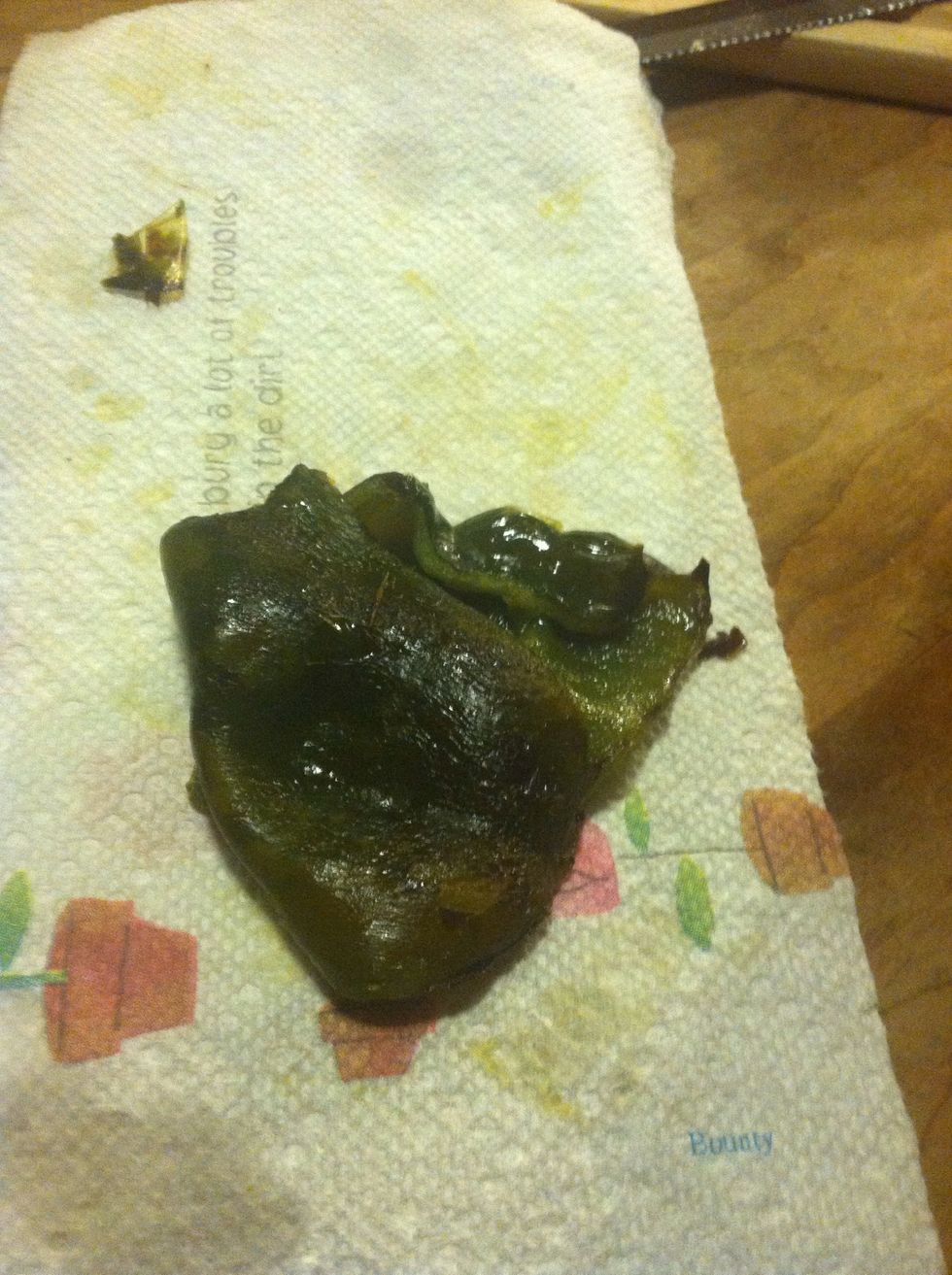Blot peppers and peel the skin off. Slice the peppers and set aside for when pork has been shredded and marinating in juices.
